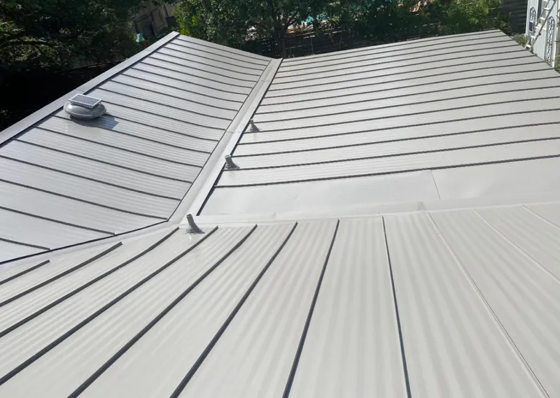 Solar attic fan installed on a metal roof for Roof Ventilation in Carmichael